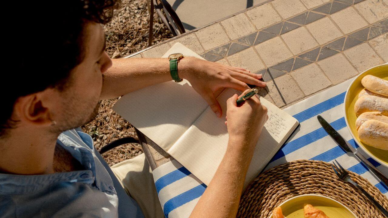 a person journaling - shadow work journal prompts for healing